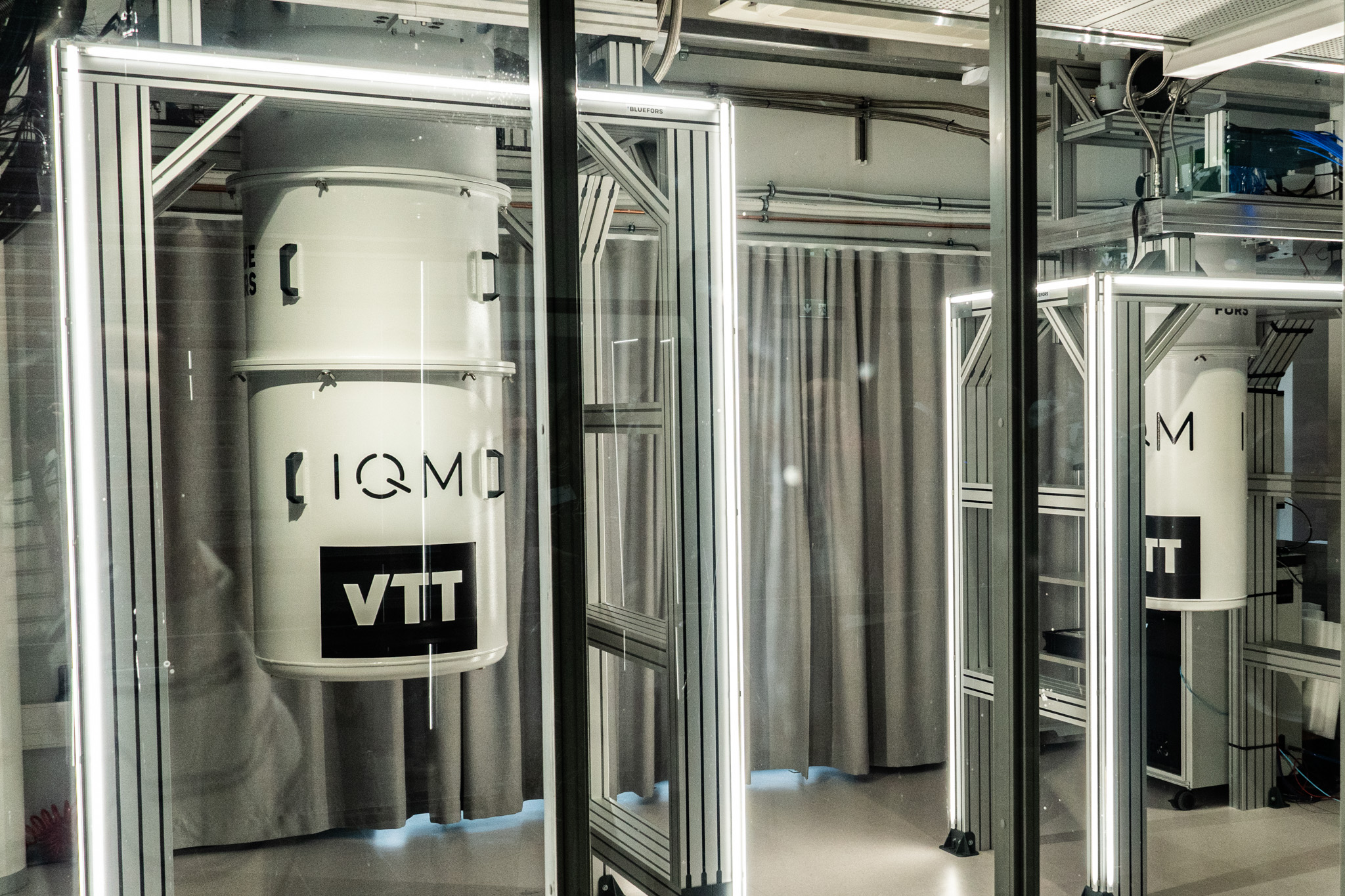 Two quantum computers sit in the their cryogenic enclosures at Micronova.
